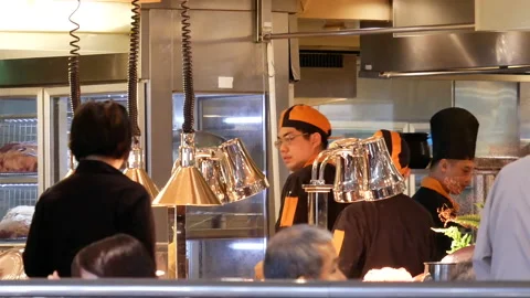 Motion of chef preparing food for customer at deli area inside restaurant Stock Footage 97041913