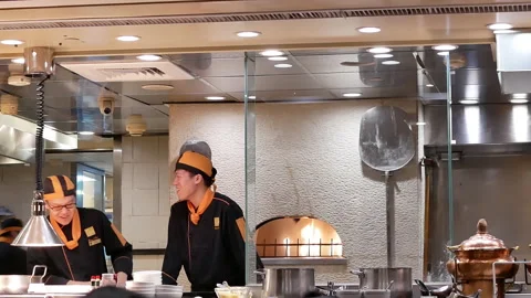 Motion of chef preparing the fried hot food for customer inside restaurant Stock Footage 96133202