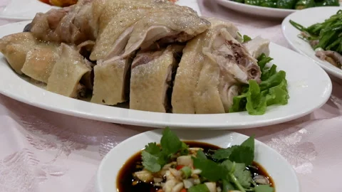 The motion of chicken and hot pepper sauce on a plate Stock Footage 167498208
