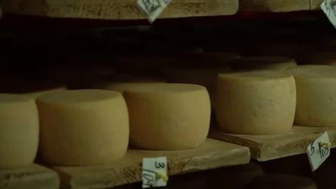 Motion close-up view of stored cheese. Video stock 119772323