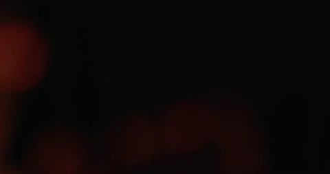 Motion of Colorful Bokeh Lights Rays on Black Background. Lamp Rays Lens Flare Stock Footage 163775289