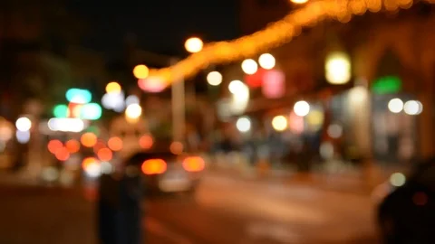 Motion of colorful diffused blurred and defocused twinkling light of city trafic Видео 100146155