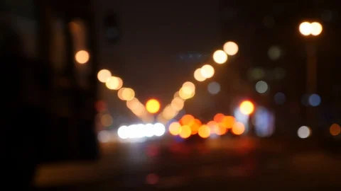 Motion of colorful diffused blurred and defocused twinkling light of city trafic Video stock 106268967