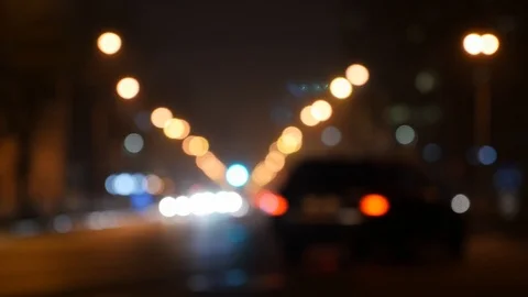 Motion of colorful diffused blurred and defocused twinkling light of city trafic Stock Footage 106269008