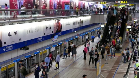 Motion of commuters walking and taking MRT during rush hour in Taipei Taiwan Video stock 98325160