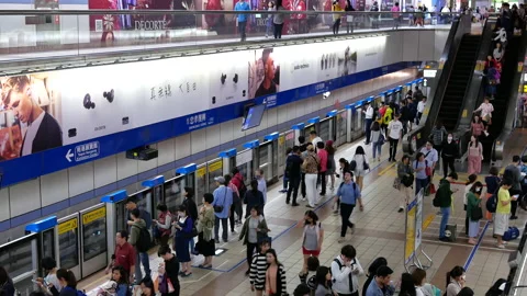 Motion of commuters walking and taking MRT during rush hour Video stock 98680531