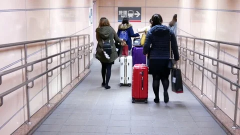 Motion of commuters walking with luggage at MRT entrance in Taipei Taiwan Stock Footage 85446142