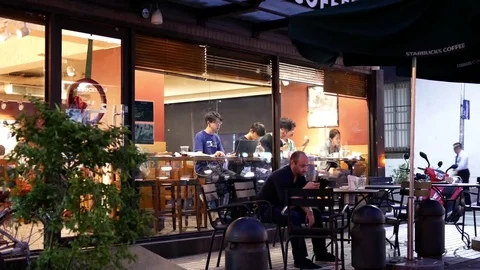 Motion of customer drinking coffee and playing computer game Stock Footage 82247653