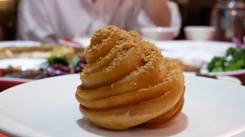 Motion of deep fry flour bun and peanut powder inside Chinese restaurant Video stock 100343403
