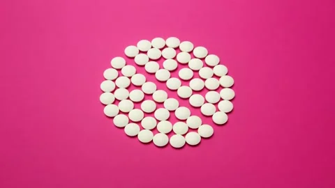 Motion design. 4K Stop motion animation of white pill on pink background. Stock Footage 160827132