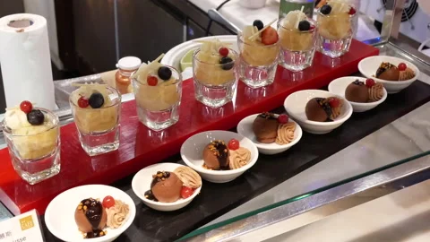 Motion of display mini dessert area inside Chinese restaurant Stock Footage 100580535