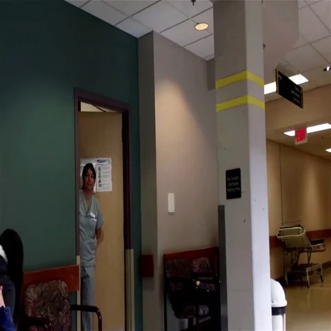 Motion of doctor calling patient inside Eagle Ridge hospital Video stock 69628386