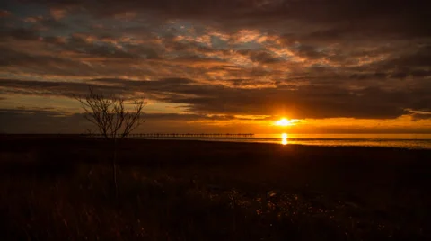 Motion dolly shot of sunset clouds by the ocean Stock-Footage 35064907