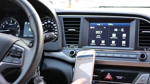 Motion of driver inputting address at GPS navigation on dashboard Stock Footage 80206717