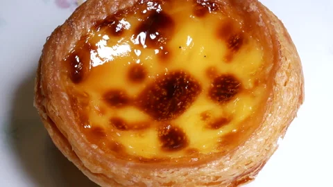 Motion of egg tart on plate with 4k resolution Stock Footage 98666122