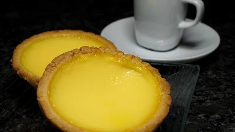 Motion of egg tarts and coffee on table with 4k resolution Video stock 77079568