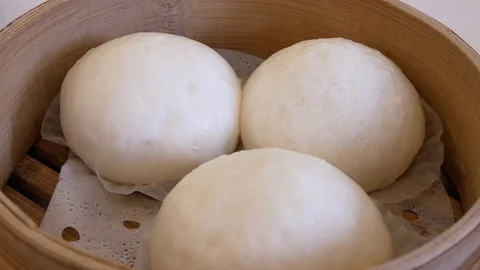 Motion of egg yolk custard bun on table inside Chinese restaurant Stock Footage 83019870