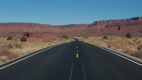 Motion On An Empty Country Road Going Into The Distance To Red Mountain Rocks Stock Footage 133515265