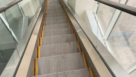 Motion of escalator metallic stairs Stock Footage 140568751