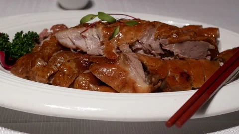 Motion of famous roasted duck on table for customer Stock Footage 99022913