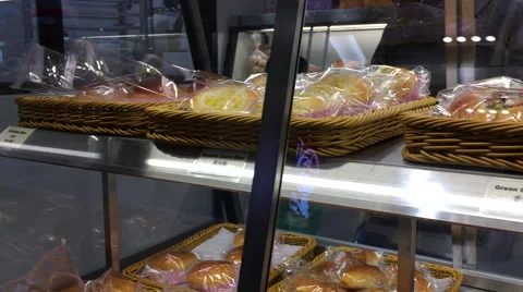 Motion of foods on display rack inside Saint Germain bakery Stock Footage 68577335