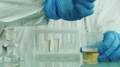 A motion footage of laboratory worker in protective suit and gloves perform.. Stock Footage 334704843