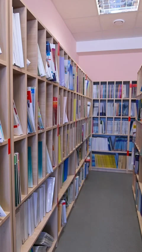 A motion footage showcasing an organized library interior with many full sh.. Stock Footage 337468932