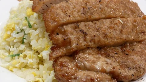 Motion of fried pork and rice on plate inside Chinese restaurant 動画素材 83369737