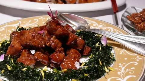 Motion of fried pork on table inside Chinese restaurant with 4k resolution. Video stock 99023234
