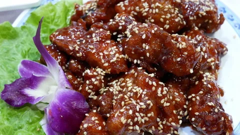 Motion of fried pork on table inside Chinese restaurant Stock Footage 100938160