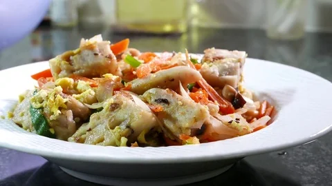 Motion of fried taro cake with vegetable and heavy steam on table at kitchen Stock Footage 83862792