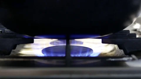 Motion of gas range in kitchen with pan on it Stock Footage 69894080