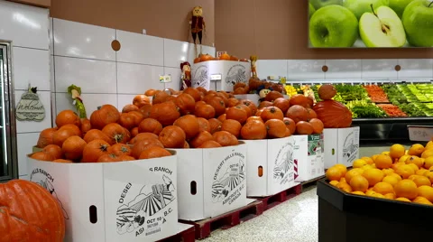 Motion of giant pumpkins for sale inside save on foods store Stock Footage 59935801