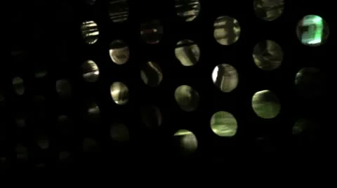Motion graphics Water reflections through mesh of holes Stock Footage 8966450