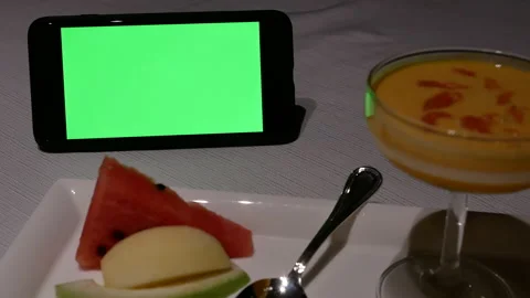 Motion of green screen phone and mango pudding dessert Stock Footage 99016091