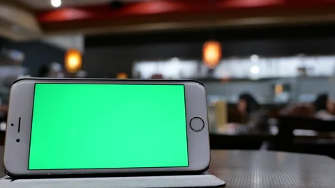 The motion of green screen phone with blur people eating food and chatting Video stock 170765199