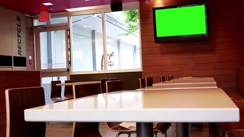 Motion of green screen tv and empty eating place at mcdonalds Stock Footage 77322501