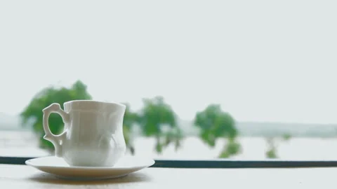 Motion hand of men using spoon to mix the coffee in the white cup. Stock Footage 156381448