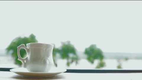 Motion hand of men using spoon to mix the coffee in the white cup. Stock Footage 156382241