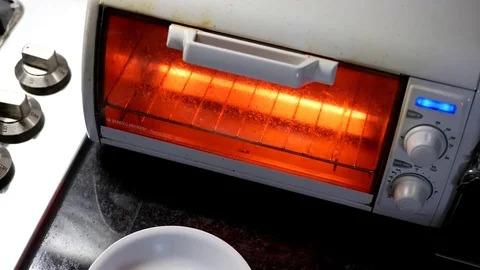 Motion of hands put fried chicken into the oven with 4k resolution Stock Footage 74575364
