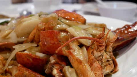 The motion of hot cooked lobster on a plate with steam at a luxury restaurant Stock Footage 265969407