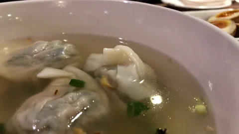 Motion of hot dumpling soup and appetizers on table inside Chinese restaurant Stock Footage 95152458