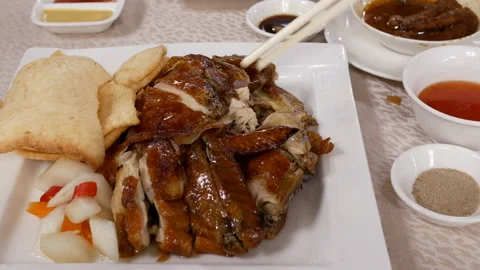 Motion of hot fried chicken on table inside Chinese restaurant Stock Footage 100941144