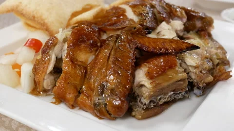 Motion of hot fried chicken on table inside Chinese restaurant Video stock 100967276