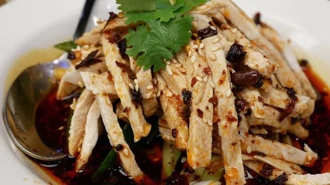 Motion of hot spicy chicken slice on table inside Chinese restaurant Video stock 83768221