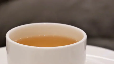 Motion of hot tea and steam inside Chinese restaurant Stock Footage 103436155