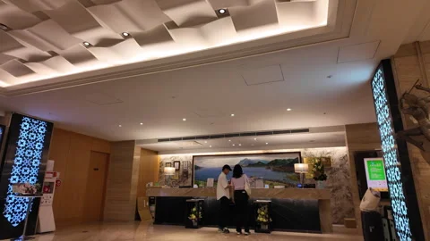 Motion of hotel reception counter with customer asking about check in question Video stock 292363680
