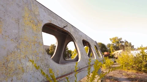 Motion imitating steps along rusty metal construction in abandoned industrial Stock-Footage 117096854