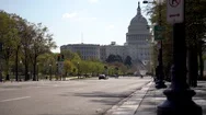 Motion To The Left Showing Us Capitol In Distance With Empty Street Mid Day. Stock Footage