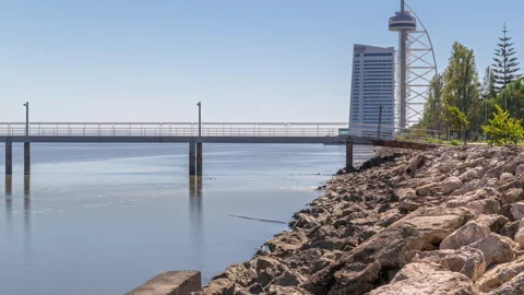 Motion from the low to high tide next to Vasco da Gama Bridge in Parque das Stock-Footage 252025225